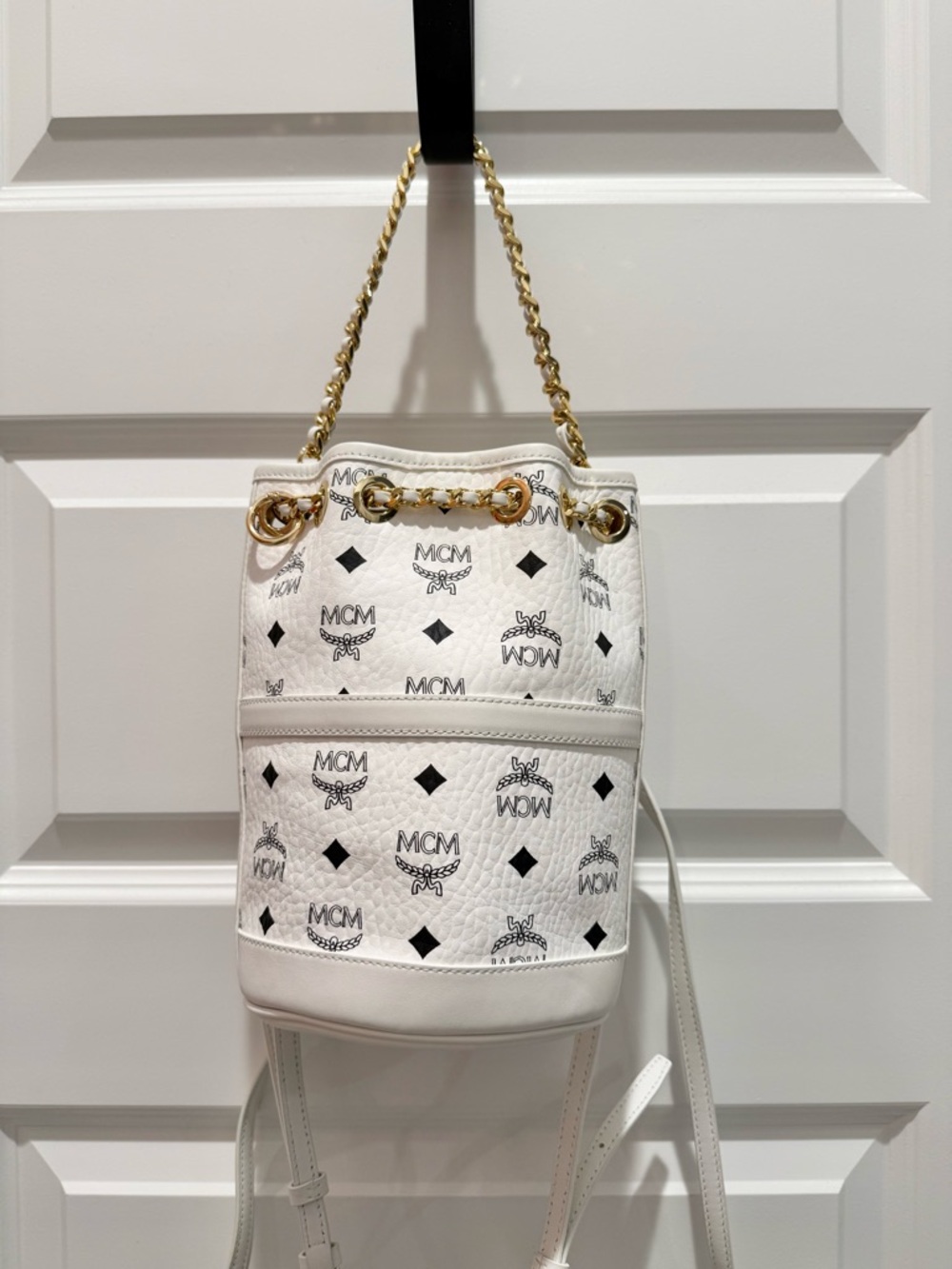 MCM 2Way White Logo Drawstring Bucket Backpack with Gold Chain Detail